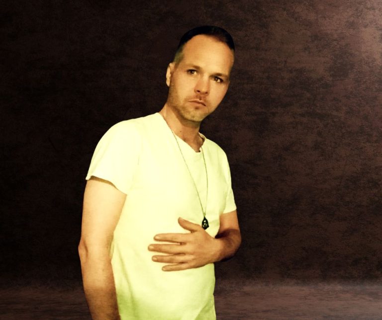 billy coull just billy dark background wearing white shirt press image